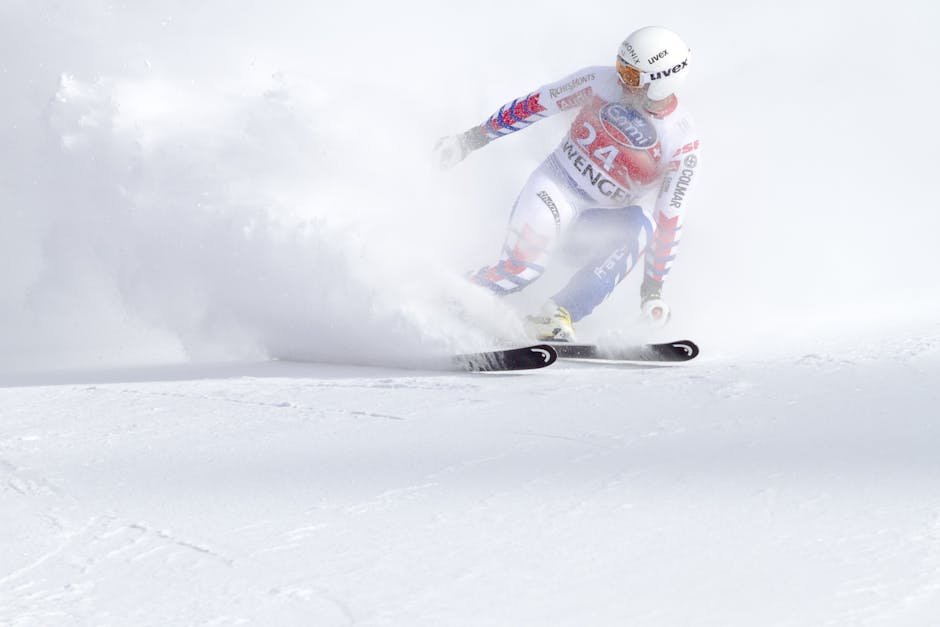A skier in motion navigating a snowy slope with speed and precision during a winter sports event.